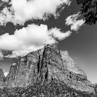 rocky mountain formation under cloudy sky