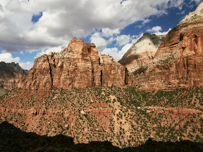 red rock canyon formations under cloudy sky