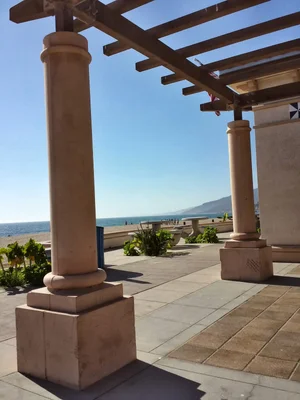 beachfront pergola with columns overlooking ocean