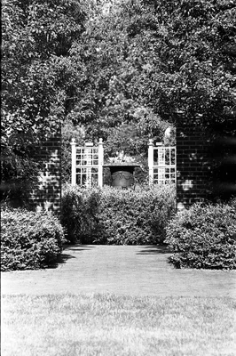 garden entrance with brick pillars and gates