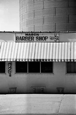 small town barber shop with striped awning