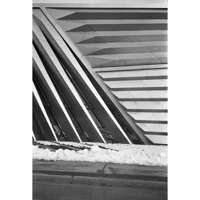 angular building facade with snow at base
