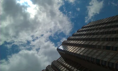 modern building against cloudy blue sky