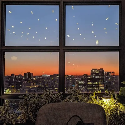 city skyline view through window at sunset