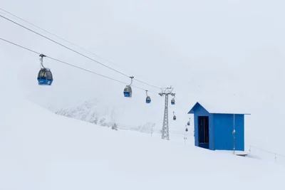 gondola lift ascending snowy mountain slope