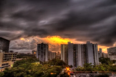 urban skyline during dramatic stormy sunset