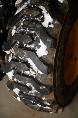 muddy tire tread with snow patches