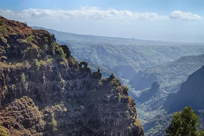 rocky canyon overlook with distant mountain ridges