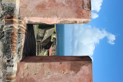 weathered colonial building ruins against blue sky
