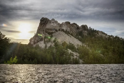 mount rushmore monument at sunset from road