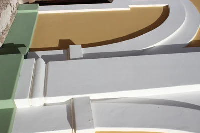 curved architectural columns with colorful painted details
