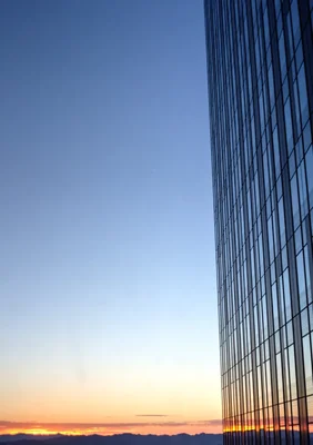 modern building facade against sunset sky