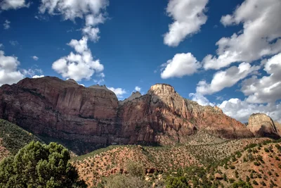 red rock canyon formations under cloudy sky